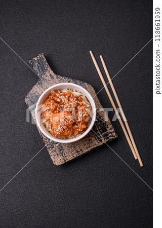 Asian food boiled rice with meat with sweet and sour sauce, spices and herbs Asian food boiled rice with meat with sweet and sour sauce, spices and herbs 118661959