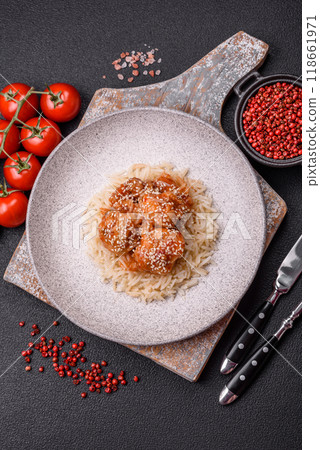 Asian food boiled rice with meat with sweet and sour sauce, spices and herbs Asian food boiled rice with meat with sweet and sour sauce, spices and herbs 118661971