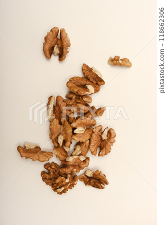 Peeled walnuts on a white background. Peeled walnuts on a white background. 118662306