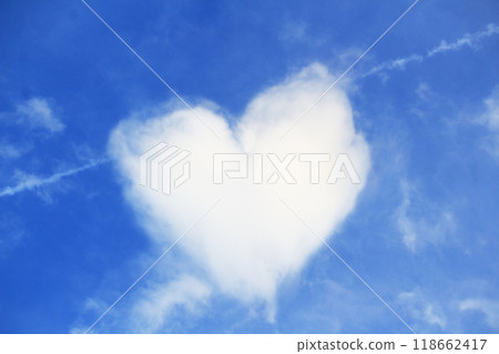 Heart in the shape of a cloud against a background of white clouds and blue sky. Greeting card for St. Valentine's Day 118662417