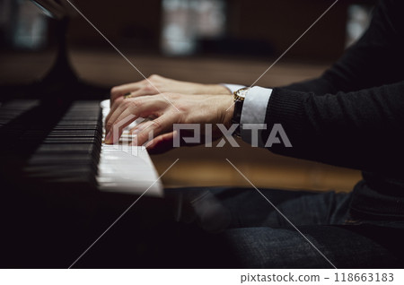 Male hands playing piano Male hands playing piano 118663183