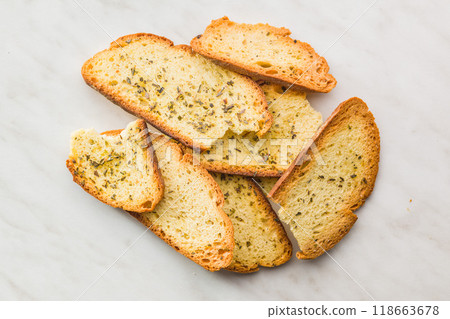 Crispy roasted bruschetta bread on kitchen table. Top view. Crispy roasted bruschetta bread on kitchen table. Top view. 118663678