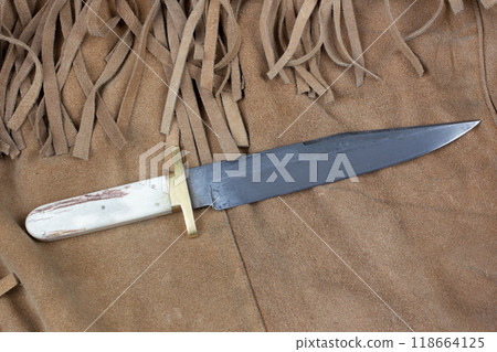 Old west bowie knife on leather jacket 118664125