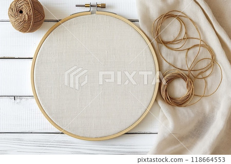 Flat lay composition with embroidery hoop and thread on white wooden background 118664553