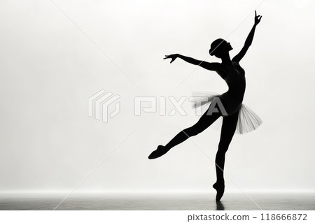 Ballerina is dancing gracefully wearing white tutu dress 118666872
