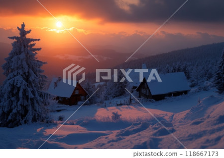 Sunset illuminating snow covered wooden cabins in mountain village 118667173