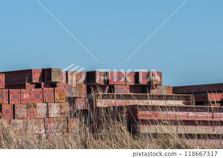 Construction materials shining against the blue sky Construction materials shining against the blue sky 118667317