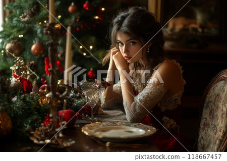 Young woman waiting at christmas dinner table with sad expression 118667457