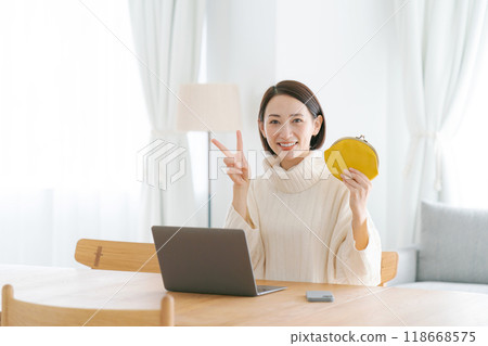 Smiling woman holding a purse Smiling woman holding a purse 118668575