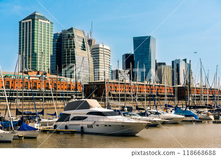 Marina and mooring of the port of Puerto Madero neighborhood in Buenos Aires with residential buildings in the background. Marina and mooring of the port of Puerto Madero neighborhood in Buenos Aires with residential buildings in the background. 118668688