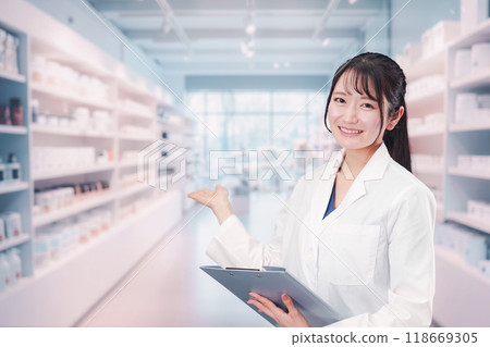 A female pharmacist working at a pharmacy 118669305