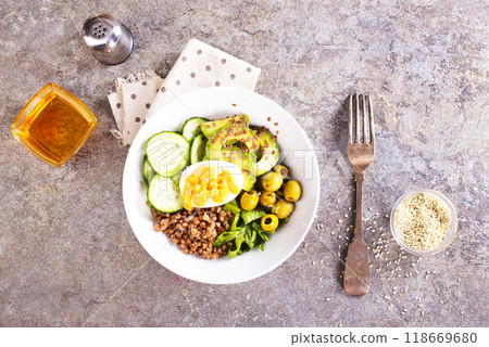 backwheat and vegetables on white plate 118669680