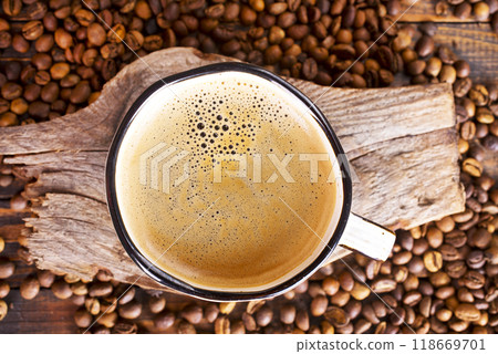 Coffee cup and coffee beans on gray background 118669701