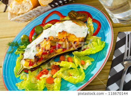 Tasty eggplant stuffed with vegetables and cheese 118670144