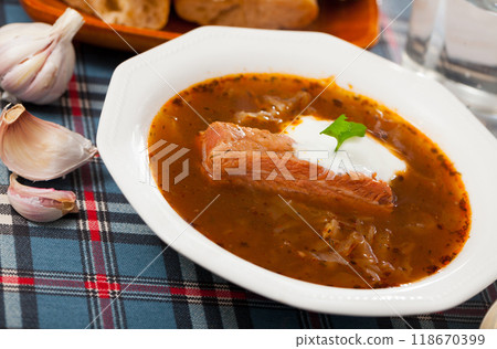 Shchi in mushroom broth with pork and sour cream 118670399
