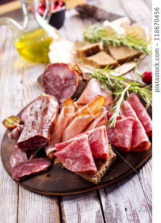Different Italian ham and salami with herbs 118670456