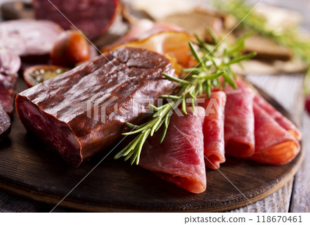 Different Italian ham and salami with herbs 118670461