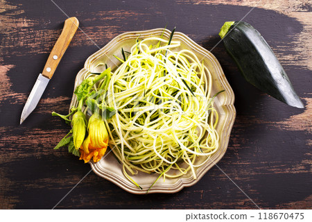 Close-Up of Fresh Zucchini Noodles on metal plate 118670475