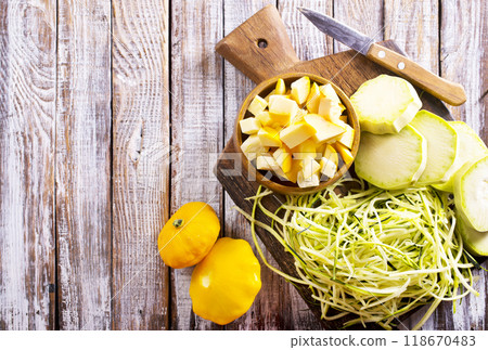 raw zucchini and patisons on board raw zucchini and patisons on board 118670483