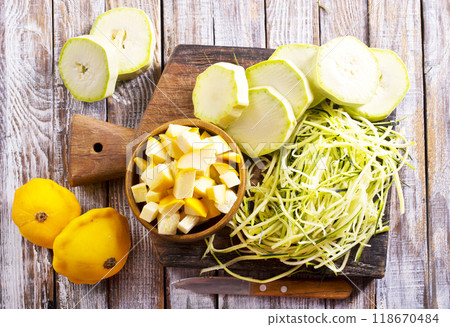 raw zucchini and patisons on board raw zucchini and patisons on board 118670484
