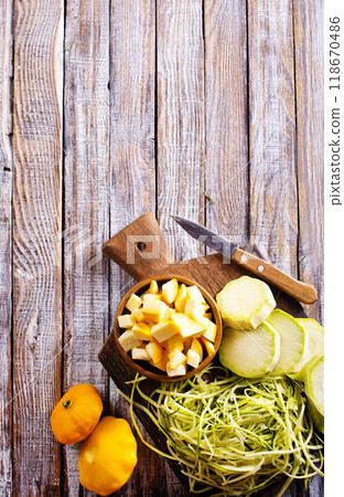 raw zucchini and patisons on board raw zucchini and patisons on board 118670486