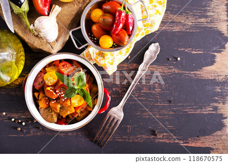 potato stew cooked with peppers, tomatoes, and onions, in bowl 118670575