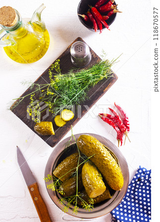 picled cucumber in bowl, cucumber with dill 118670577