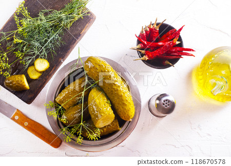 picled cucumber in bowl, cucumber with dill 118670578