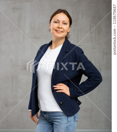 Smiling adult woman posing in jacket 118670687