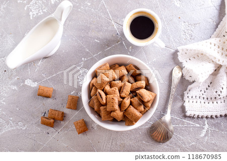 sweet crunchy chocolate children's breakfast on a gray background. 118670985
