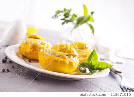 Veggie stuffed round cougretes on white plate Veggie stuffed round cougretes on white plate 118671010
