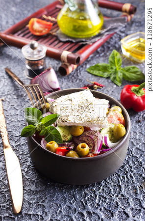 Greek salad with tomatoes, feta cheese, cucumbers, onions and olives Greek salad with tomatoes, feta cheese, cucumbers, onions and olives 118671295