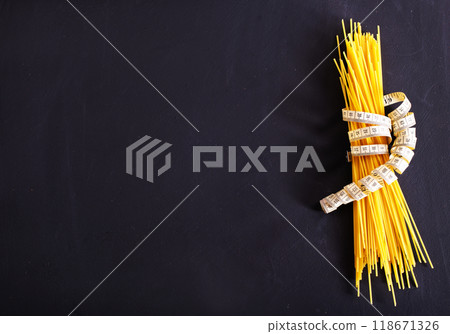 string spaghetti on black background string spaghetti on black background 118671326