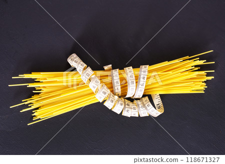 string spaghetti on black background string spaghetti on black background 118671327