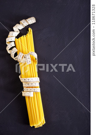 string spaghetti on black background string spaghetti on black background 118671328