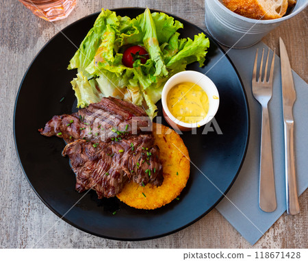 Fried beef with tomato, sauce and herbs. French traditional dish 118671428