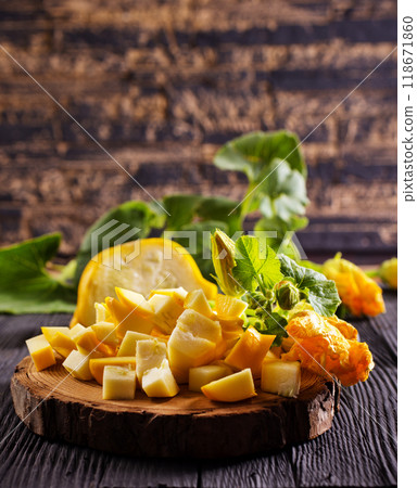 Young yellow patisons with green leaves Young yellow patisons with green leaves 118671860