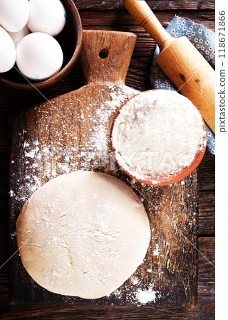 Fresh dough on board with flour 118671866