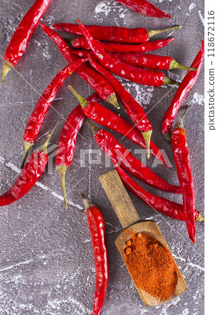 Red pepper on a dark stone background. Selective focus. Red pepper on a dark stone background. Selective focus. 118672116