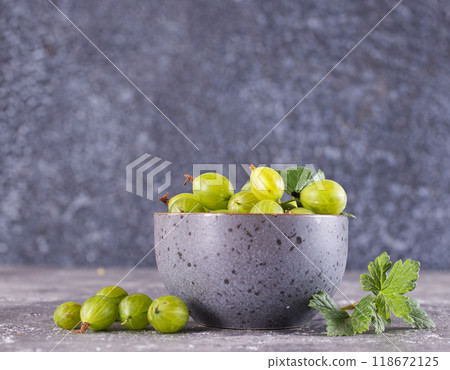 Fresh gooseberry in gray bowl on a table 118672125