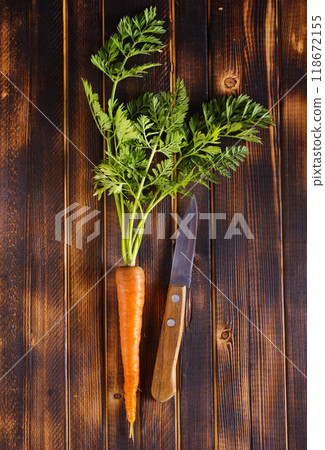 Orange and yellow carrots on a table Orange and yellow carrots on a table 118672155