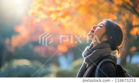 Woman in Autumn Japanese Garden 118673258