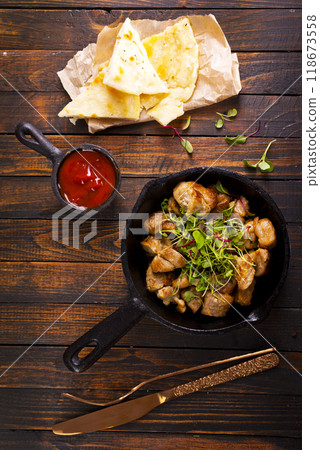 fried meat with spices in pan fried meat with spices in pan 118673558