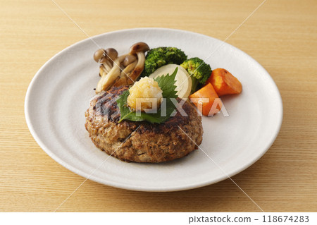 Japanese-style hamburger steak topped with grated daikon radish Japanese-style hamburger steak topped with grated daikon radish 118674283