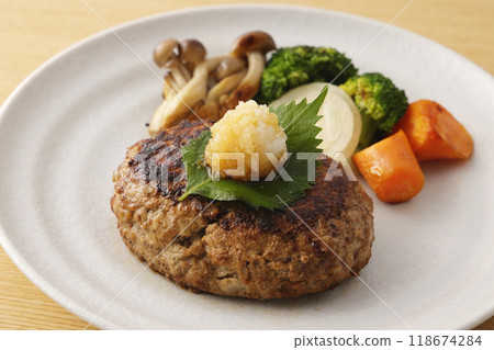 Japanese-style hamburger steak topped with grated daikon radish 118674284
