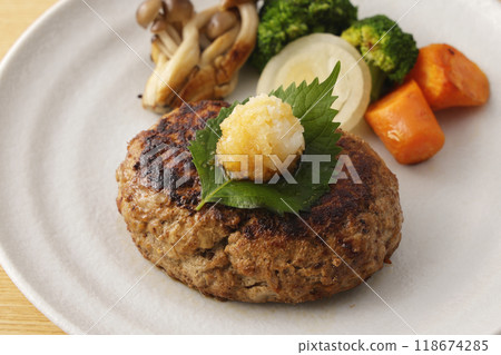 Japanese-style hamburger steak topped with grated daikon radish 118674285