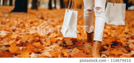 Ai generated Young woman holding paper shopping bag in autumn park in nature. 118674818