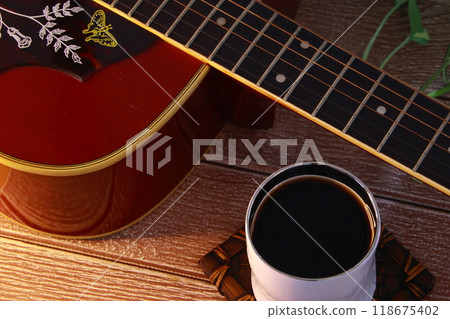Iced coffee in a white cup and a guitar - How to spend your days off 118675402