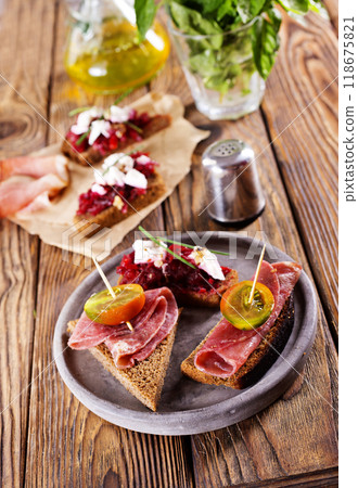 Traditional Spanish Jamon Serrano ham, Prosciutto Crudo, Parma ham, Italian antipasto Traditional Spanish Jamon Serrano ham, Prosciutto Crudo, Parma ham, Italian antipasto 118675821