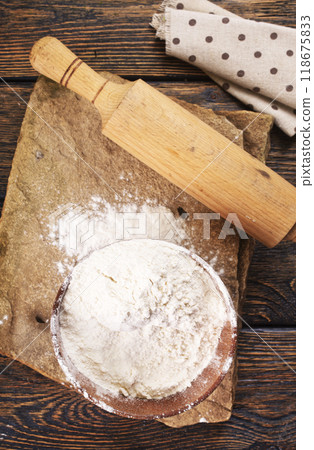Close up of bowl of flour on wooden table 118675833